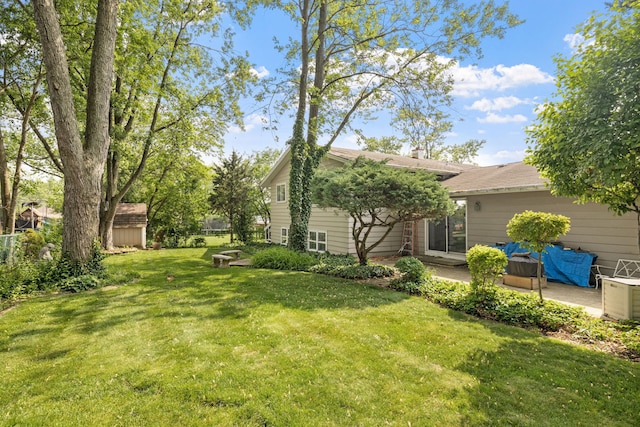 5927 Sherman Dr, Woodridge, IL 60517 - view of grassy yard featuring a patio