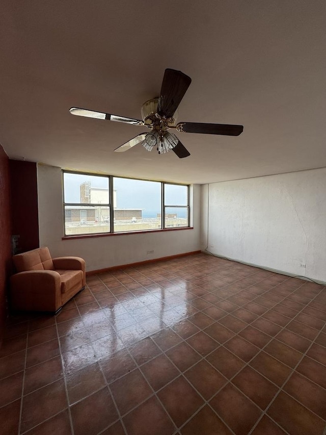 6301 N Sheridan Rd Unit 24C, Chicago, IL 60660 - empty room with ceiling fan and dark tile patterned floors