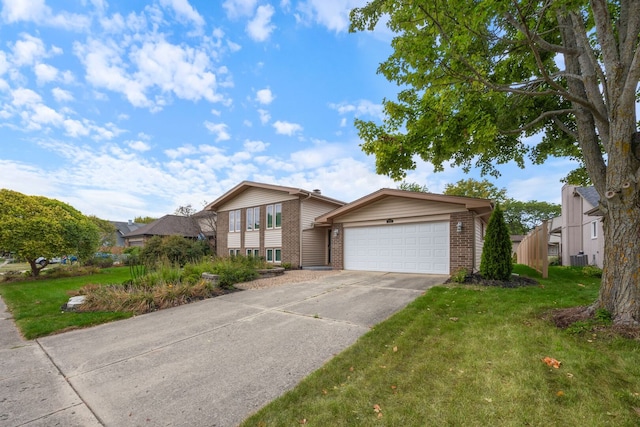 773 Farnham Ln, Wheaton, IL 60189 - tri-level home with brick siding, a garage, driveway, and a front yard