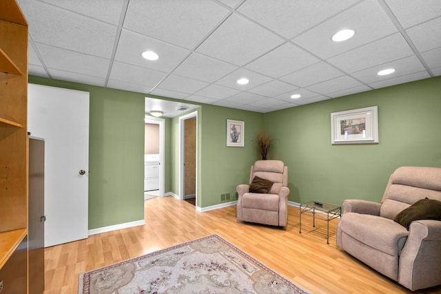 773 Farnham Ln, Wheaton, IL 60189 - sitting room featuring washer / dryer, wood finished floors, recessed lighting, and a paneled ceiling