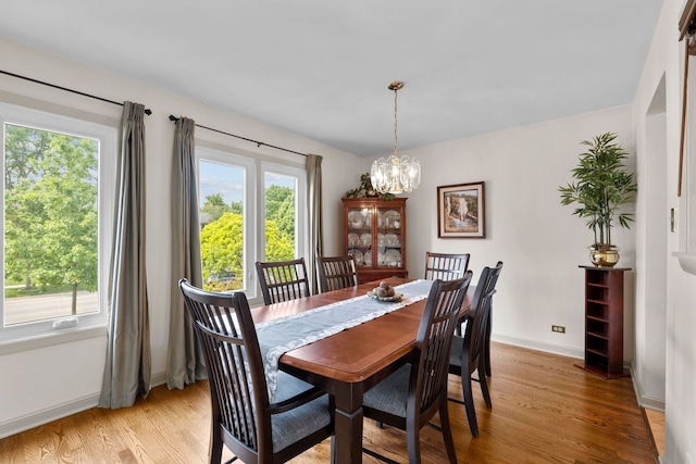 773 Farnham Ln, Wheaton, IL 60189 - dining space featuring a chandelier and light wood-style floors
