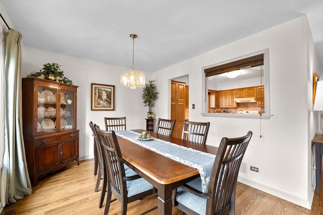773 Farnham Ln, Wheaton, IL 60189 - dining room featuring light wood-style flooring and a chandelier