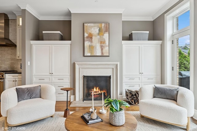 1230 W Cornelia Ave, Chicago, IL 60657 - living room with light wood-style flooring, ornamental molding, and a lit fireplace
