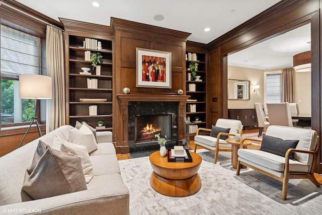 1230 W Cornelia Ave, Chicago, IL 60657 - living room with crown molding, a fireplace, wood finished floors, built in shelves, and recessed lighting