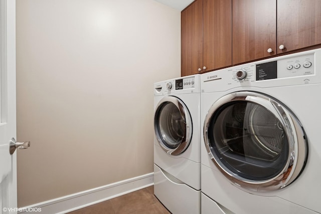 1230 W Cornelia Ave, Chicago, IL 60657 - laundry area featuring cabinet space and washer and dryer