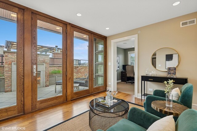 1230 W Cornelia Ave, Chicago, IL 60657 - living room featuring wood finished floors, a fireplace, and recessed lighting