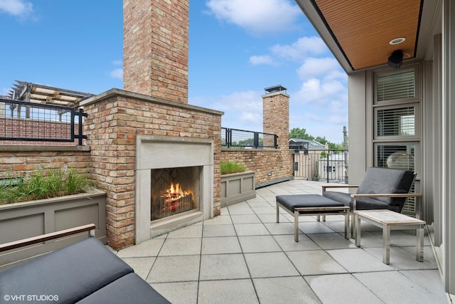 1230 W Cornelia Ave, Chicago, IL 60657 - view of patio / terrace featuring an outdoor brick fireplace
