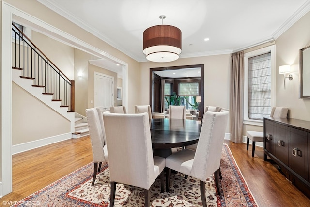 1230 W Cornelia Ave, Chicago, IL 60657 - dining area with wood finished floors, stairway, ornamental molding, and recessed lighting
