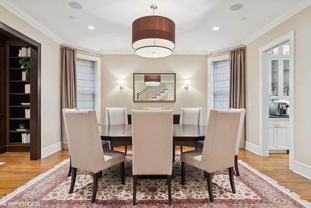 1230 W Cornelia Ave, Chicago, IL 60657 - dining area featuring wood finished floors, ornamental molding, and recessed lighting
