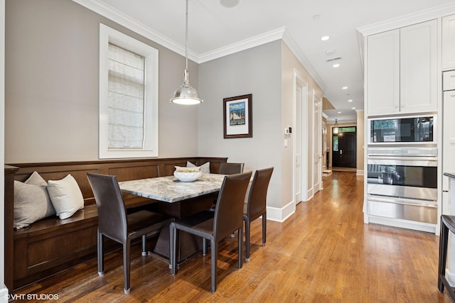 1230 W Cornelia Ave, Chicago, IL 60657 - dining space featuring crown molding, light wood finished floors, and recessed lighting