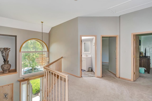 16924 Yearling Crossing Dr, Orland Park, IL 60467 - hall with attic access, light colored carpet, an upstairs landing, vaulted ceiling, and baseboards