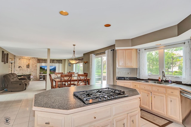 16924 Yearling Crossing Dr, Orland Park, IL 60467 - kitchen with a sink, dishwasher, gas stovetop, open floor plan, and light tile patterned flooring