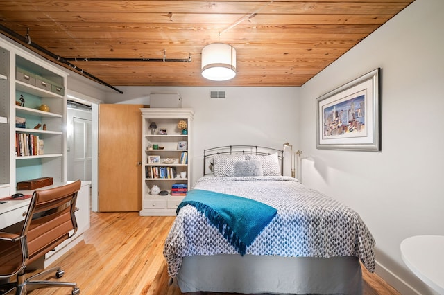 2111 W Churchill St Unit 112, Chicago, IL 60647 - bedroom with wooden ceiling and light wood-style flooring