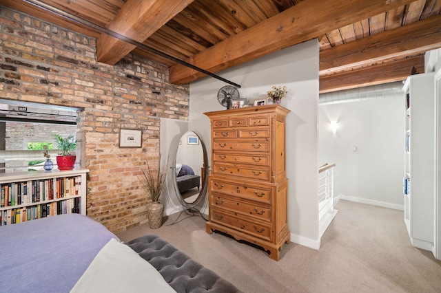 2111 W Churchill St Unit 112, Chicago, IL 60647 - bedroom with a wooden ceiling with exposed beams, brick wall, and light colored carpet