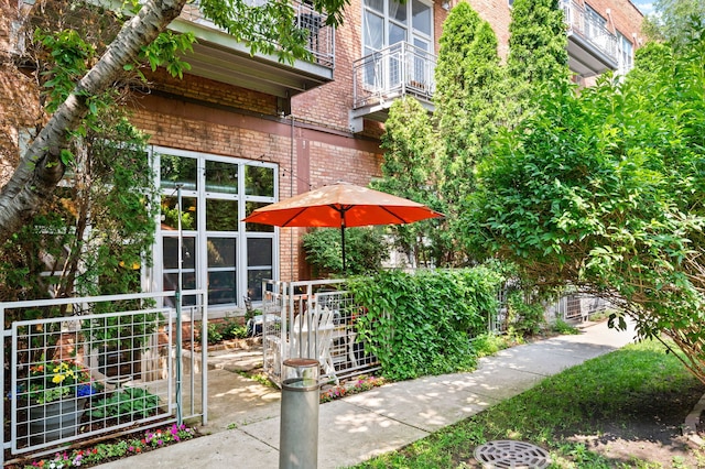 2111 W Churchill St Unit 112, Chicago, IL 60647 - view of property exterior with brick siding