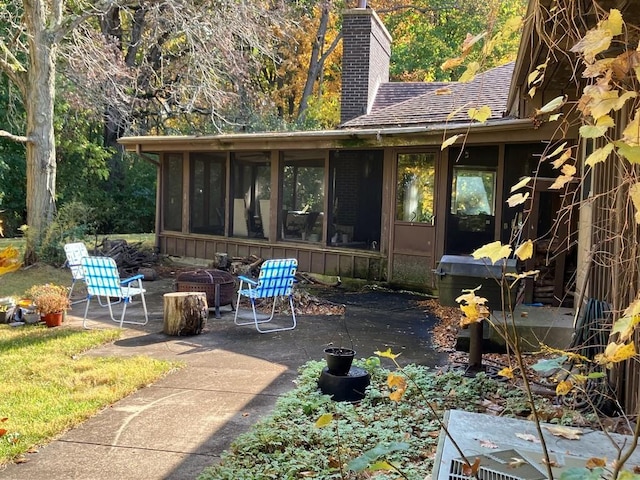 27125 N Williams Park Rd N, Wauconda, IL 60084 - view of patio / terrace featuring a sunroom and a fire pit