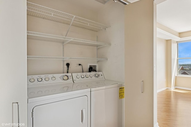 77 S Evergreen Ave Unit 707, Arlington Heights, IL 60005 - washroom with baseboards, washing machine and clothes dryer, and wood finished floors