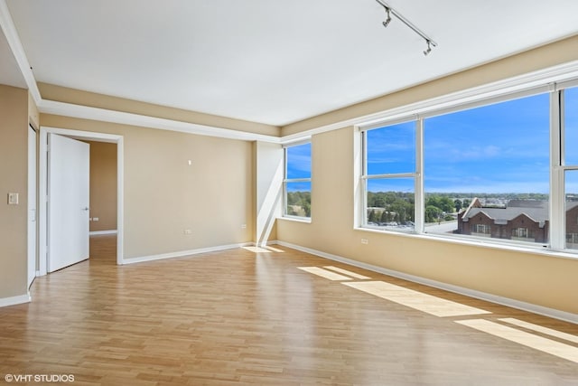 77 S Evergreen Ave Unit 707, Arlington Heights, IL 60005 - empty room with rail lighting, light wood-style flooring, and baseboards