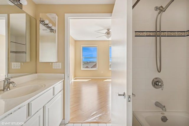 77 S Evergreen Ave Unit 707, Arlington Heights, IL 60005 - bathroom with vanity, shower / bathtub combination, wood finished floors, and baseboards