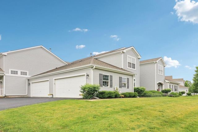 245 Grays Dr, Oswego, IL 60543 - view of front of home with an attached garage, asphalt driveway, a front lawn, and a shingled roof