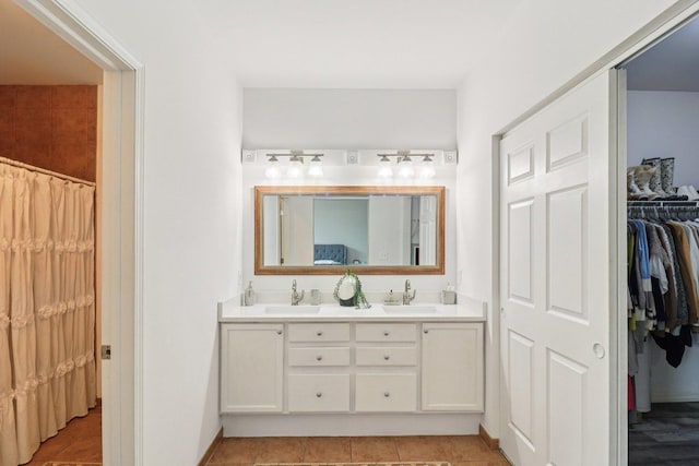 245 Grays Dr, Oswego, IL 60543 - full bathroom featuring double vanity, tile patterned flooring, and a walk in closet