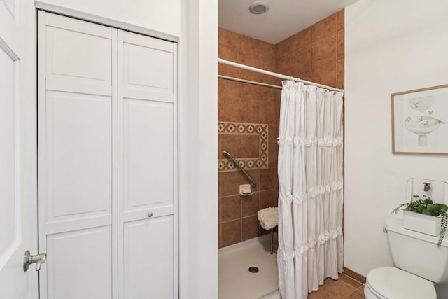 245 Grays Dr, Oswego, IL 60543 - full bathroom with a stall shower, toilet, tile patterned floors, and a closet