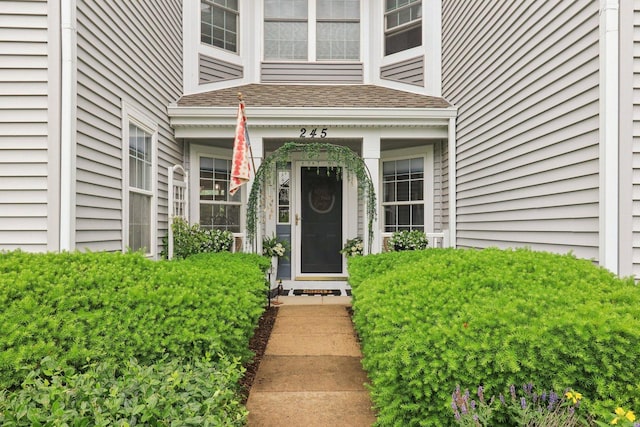 245 Grays Dr, Oswego, IL 60543 - property entrance featuring a shingled roof