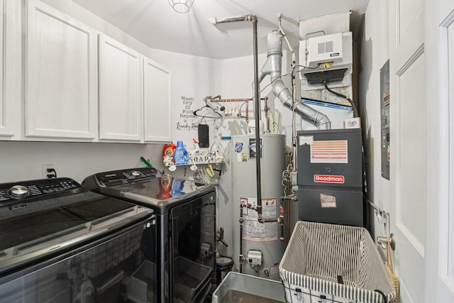 245 Grays Dr, Oswego, IL 60543 - laundry area with cabinet space, gas water heater, and washing machine and dryer