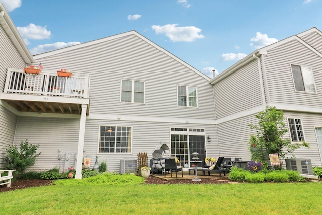 245 Grays Dr, Oswego, IL 60543 - rear view of house featuring a yard, cooling unit, a balcony, and a patio area