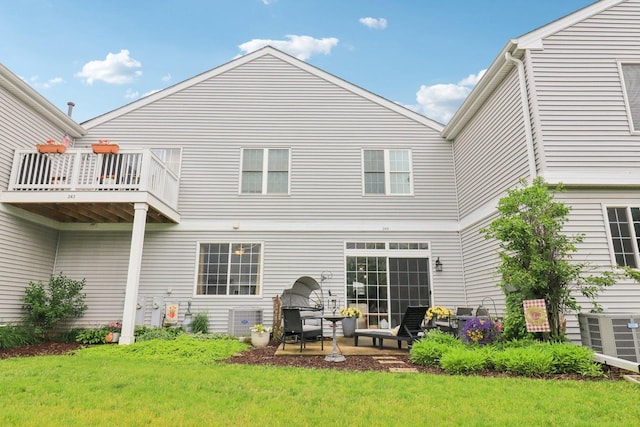 245 Grays Dr, Oswego, IL 60543 - rear view of house featuring a lawn and a balcony