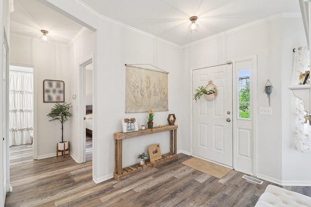 245 Grays Dr, Oswego, IL 60543 - foyer featuring wood finished floors, ornamental molding, and baseboards