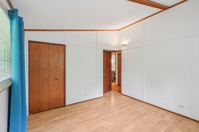 20214 Harmony Rd, Marengo, IL 60152 - unfurnished bedroom featuring light wood-style floors, a closet, and lofted ceiling