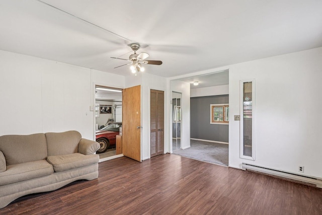 20214 Harmony Rd, Marengo, IL 60152 - living room with baseboard heating, a ceiling fan, and wood finished floors