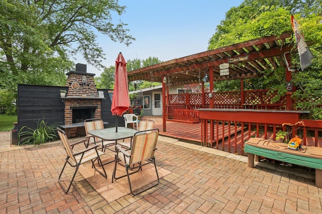 20214 Harmony Rd, Marengo, IL 60152 - view of patio featuring an outdoor brick fireplace, a pergola, a deck, and outdoor dining space