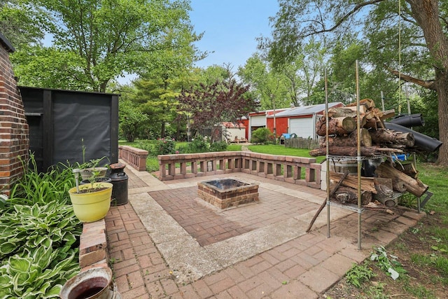 20214 Harmony Rd, Marengo, IL 60152 - view of patio / terrace with an outdoor fire pit and an outdoor structure