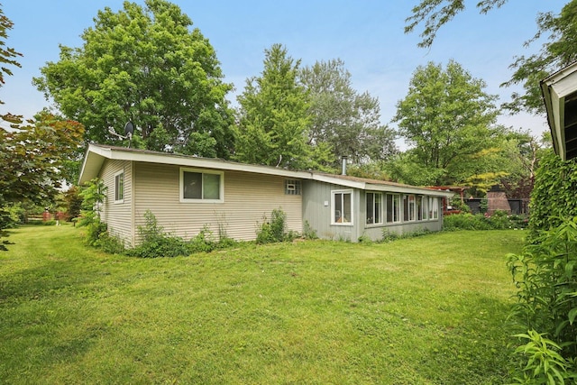 20214 Harmony Rd, Marengo, IL 60152 - rear view of house featuring a lawn