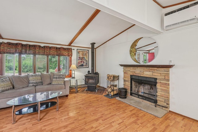 20214 Harmony Rd, Marengo, IL 60152 - living room with a wall unit AC, wood finished floors, ornamental molding, a wood stove, and baseboards