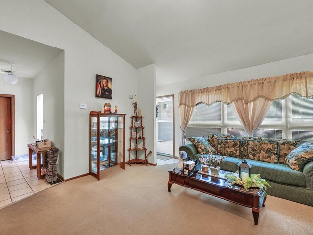 1518 Golfview Rd Unit 1, Rantoul, IL 61866 - living area with light colored carpet, lofted ceiling, and light tile patterned floors