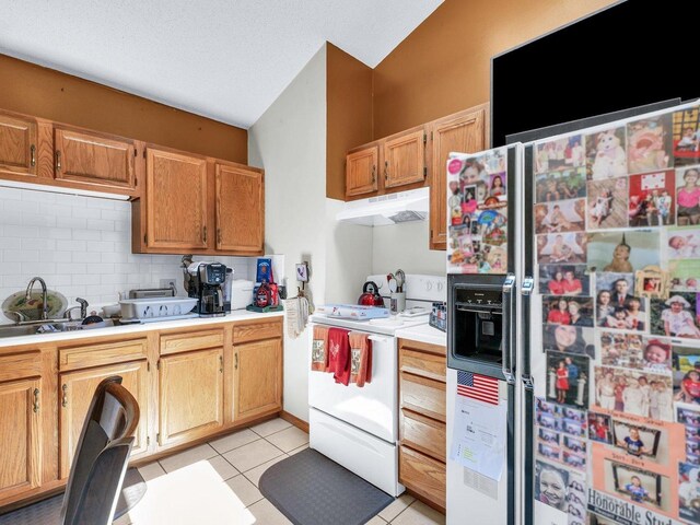1518 Golfview Rd Unit 1, Rantoul, IL 61866 - kitchen with white appliances, high vaulted ceiling, a skylight, under cabinet range hood, and light countertops