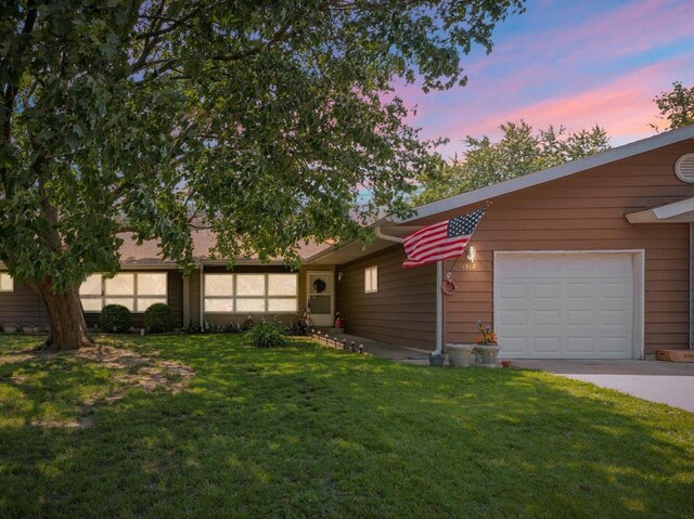 1518 Golfview Rd Unit 1, Rantoul, IL 61866 - view of front facade with a lawn, concrete driveway, and an attached garage