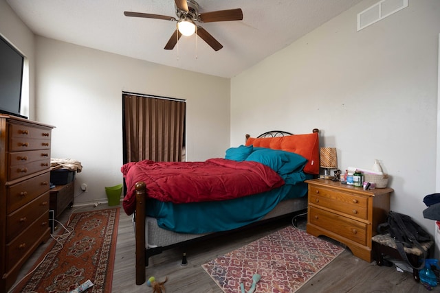 602 S Elm St, Villa Grove, IL 61956 - bedroom featuring wood finished floors and a ceiling fan
