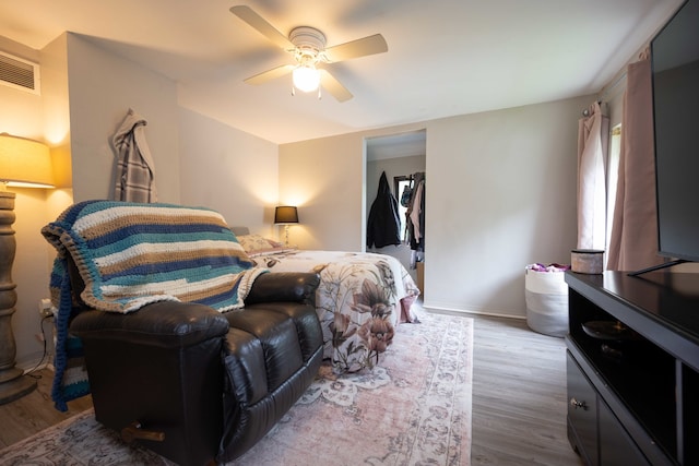 602 S Elm St, Villa Grove, IL 61956 - bedroom with wood finished floors and ceiling fan