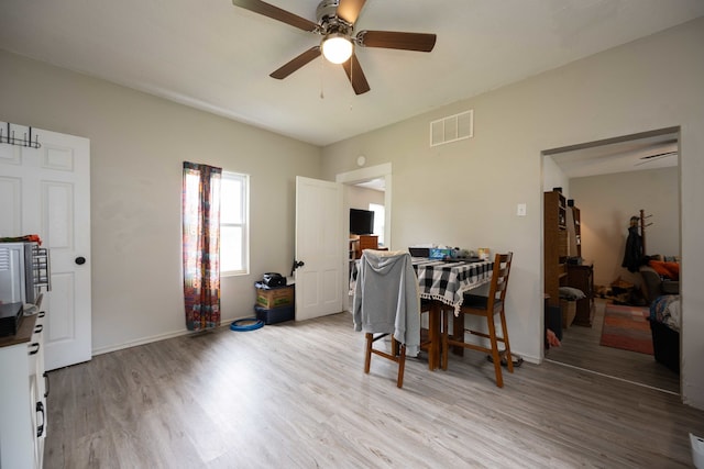 602 S Elm St, Villa Grove, IL 61956 - dining space with light wood-style floors and a ceiling fan