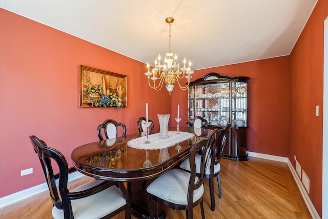 890 Woodcrest Ln, Lemont, IL 60439 - dining space with a chandelier and light wood finished floors