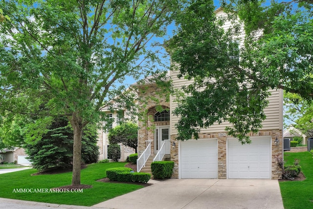 740 Manor Hill Pl, Sugar Grove, IL 60554 - view of front of house with an attached garage, driveway, a front yard, and stone siding