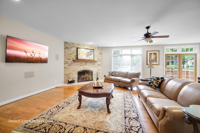 740 Manor Hill Pl, Sugar Grove, IL 60554 - living room with light wood finished floors, a ceiling fan, and a brick fireplace