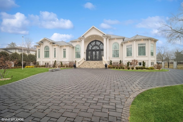 2315 N Arlington Heights Rd, Arlington Heights, IL 60004 - mediterranean / spanish-style home with curved driveway, stucco siding, french doors, and a front yard