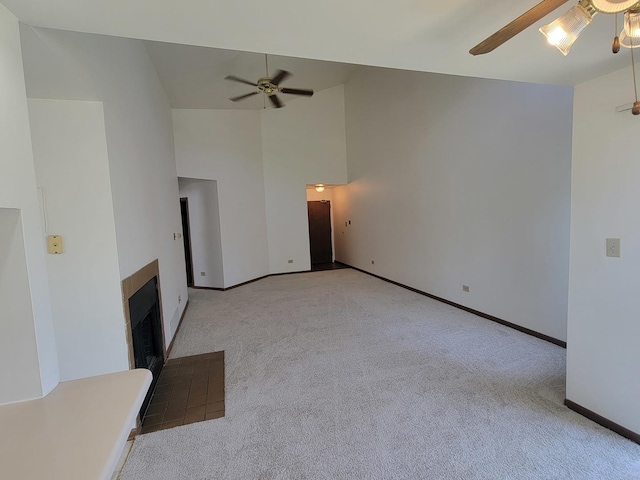 116 White Oak Ct Unit 5, Schaumburg, IL 60195 - unfurnished living room featuring ceiling fan, carpet floors, a fireplace with flush hearth, and high vaulted ceiling
