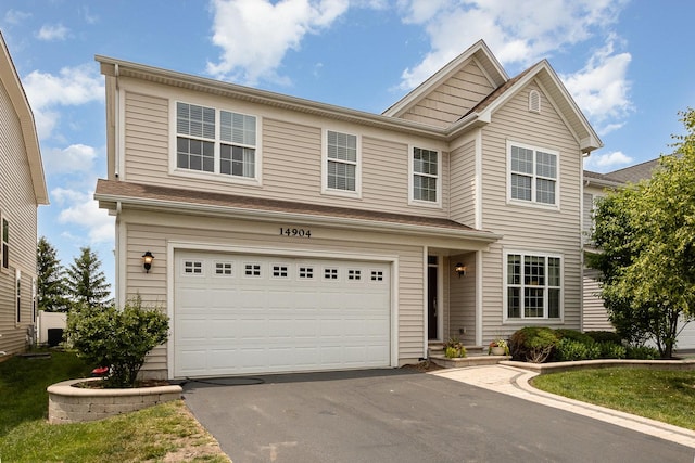 14904 S Morgan Ln, Plainfield, IL 60544 - view of front of home featuring asphalt driveway and an attached garage