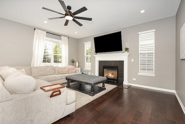 14904 S Morgan Ln, Plainfield, IL 60544 - living area with dark wood-style flooring, a ceiling fan, recessed lighting, and a tiled fireplace